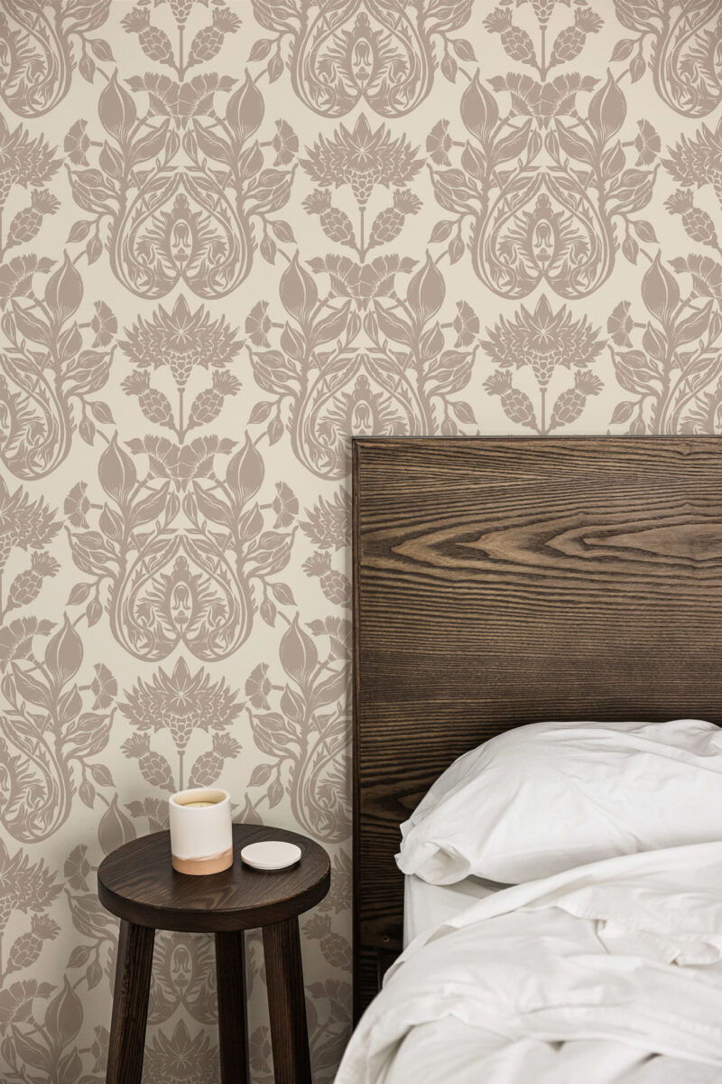 Vintage Cream Damask peel and stick wallpaper in a bedroom, with a soft taupe floral damask pattern behind the bed.