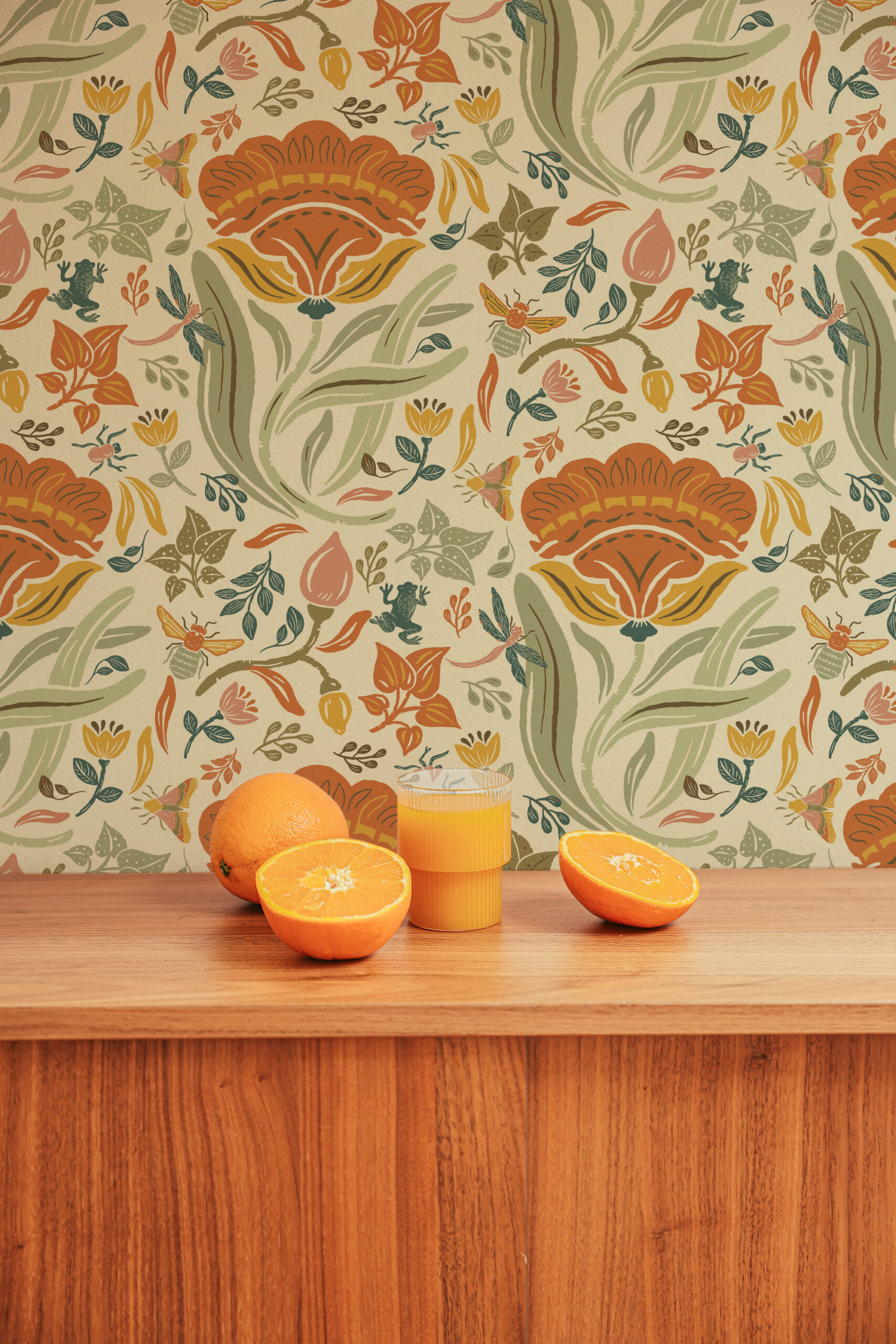 Bold Beige Floral peel and stick wallpaper with oversized orange flowers, green leaves, and small insects on a tan ground.