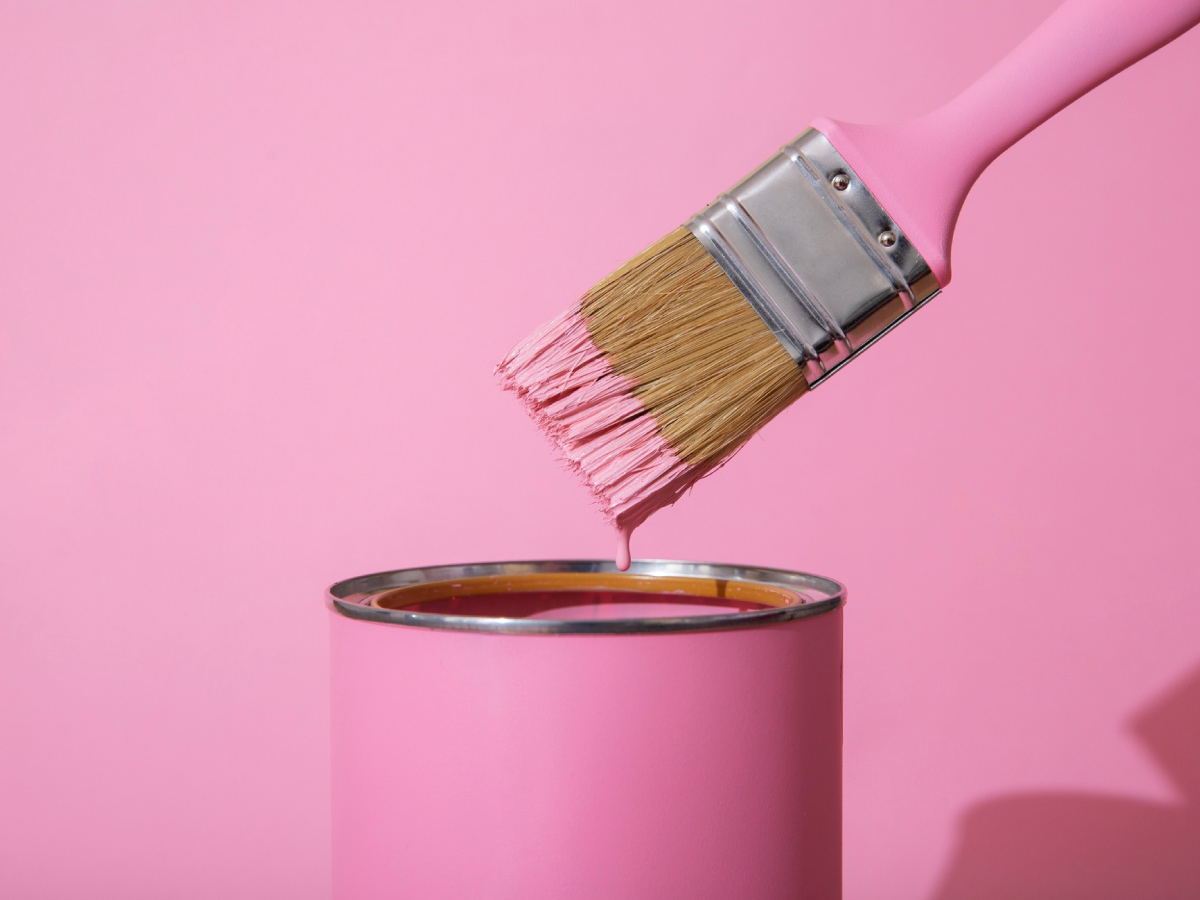 pink wall paint and brush