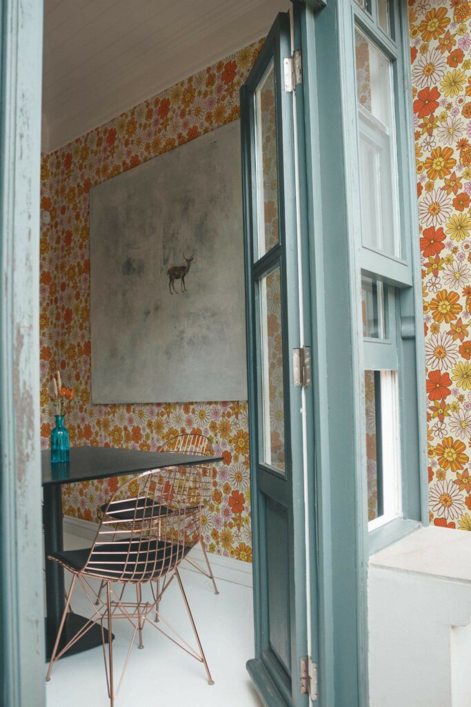 Minimal coastal style cafe decorated with 70s floral peel and stick wallpaper