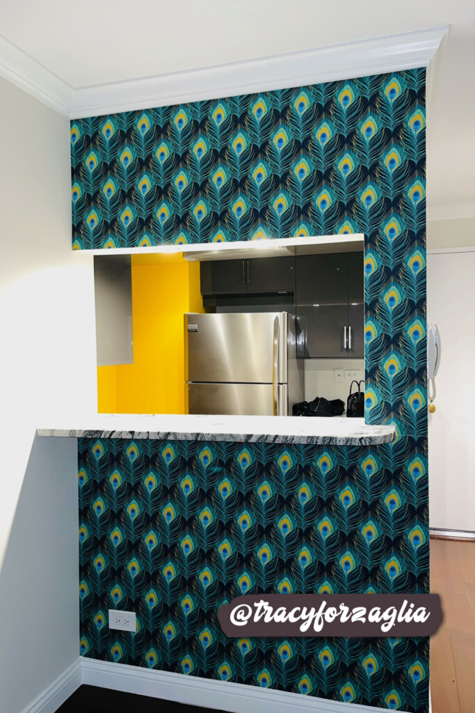 Vibrant peacock-themed wallpaper transforms a kitchen bar area into a statement feature, blending rich colors and intricate patterns for a luxurious and dynamic design