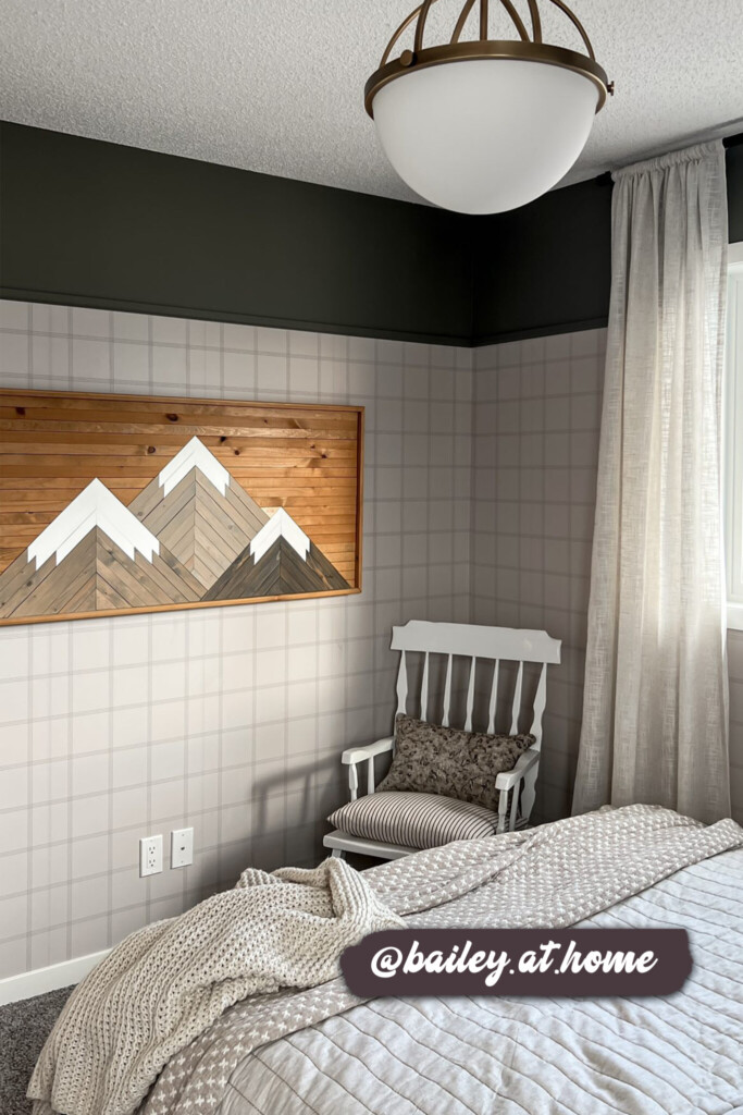 Contemporary bedroom featuring grid-style wallpaper and layered textures, creating a calm and inviting atmosphere