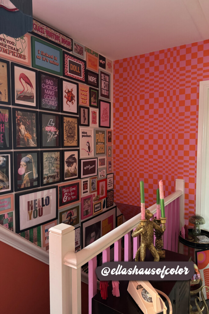 Bold orange and pink checkered wallpaper adding a retro vibe to a creative and colorful staircase wall