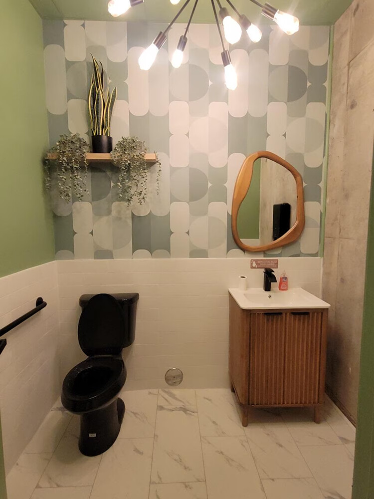 Sage green midcentury peel and stick wallpaper installed in toilet - review picture submitted by Jurgis