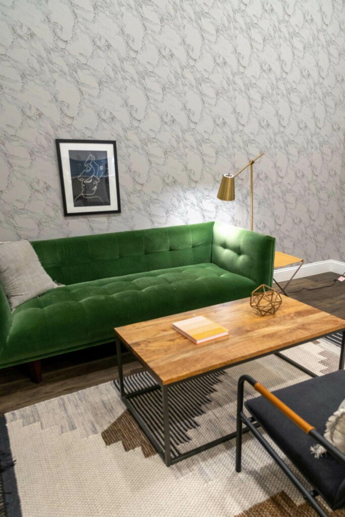 Mid-century modern living room decorated with Aesthetic marble peel and stick wallpaper and forest green sofa