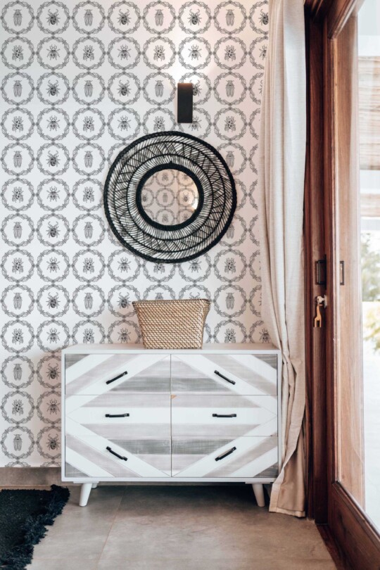 Fancy Walls peel and stick wallpaper featuring cute gothic insects in black and white vintage frames Gothic Insect Charm wallpaper in boho living room interior