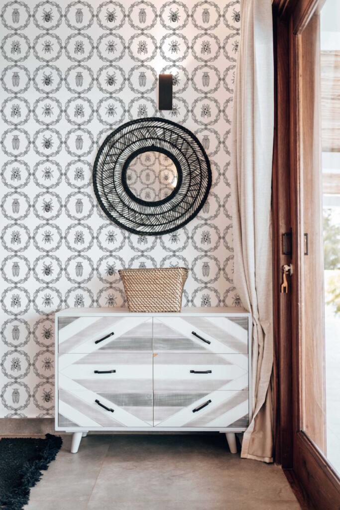 Fancy Walls peel and stick wallpaper featuring cute gothic insects in black and white vintage frames Gothic Insect Charm wallpaper in boho living room interior