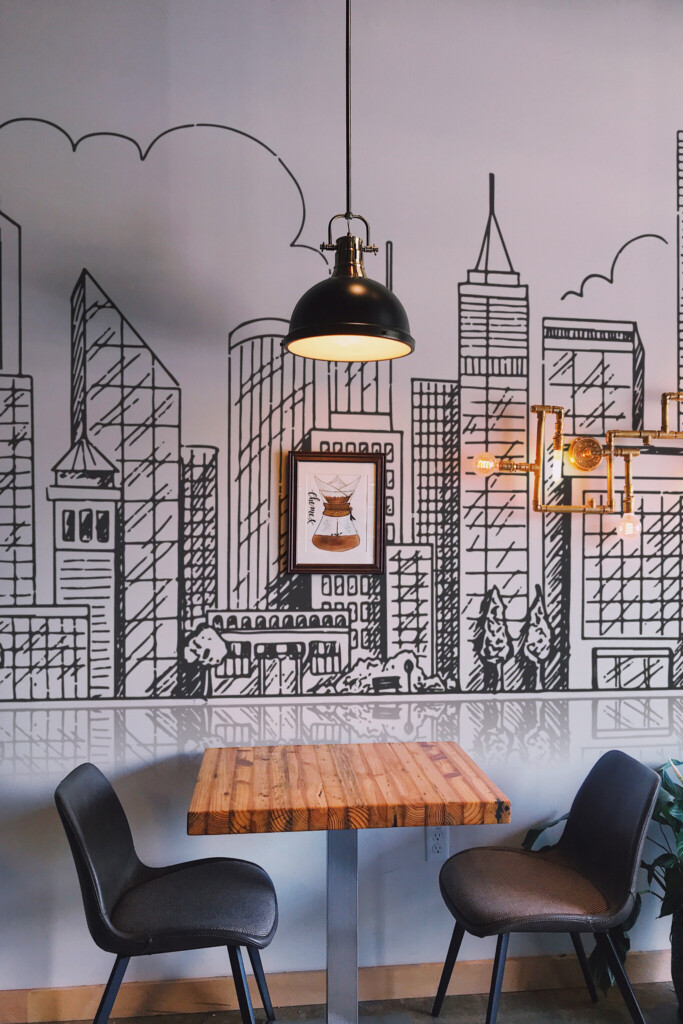 Peel and stick wall murals featuring hand-drawn city buildings in linear style with reflective skyline effect in black and white. The Fancy Walls peel and stick or non-pasted wallpaper.