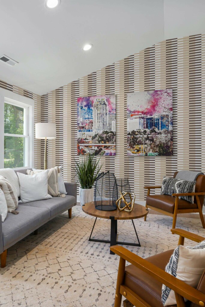 Mid-century modern style living room decorated with Beige and brown striped peel and stick wallpaper and colorful funky artwork