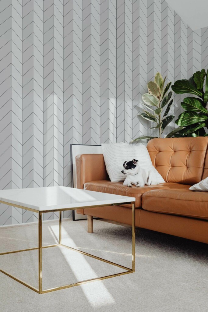 Mid-century modern style living room with dog on a sofa decorated with Bison taupe herringbone peel and stick wallpaper