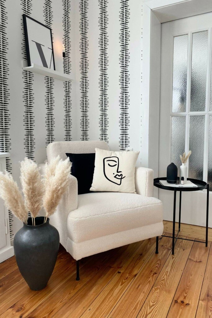 Modern boho style living room decorated with Black and white boho stripe peel and stick wallpaper