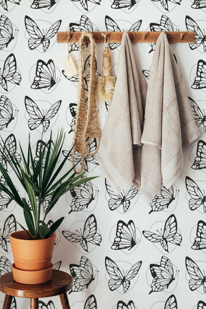 Boho style bathroom decorated with Black and white butterflies peel and stick wallpaper