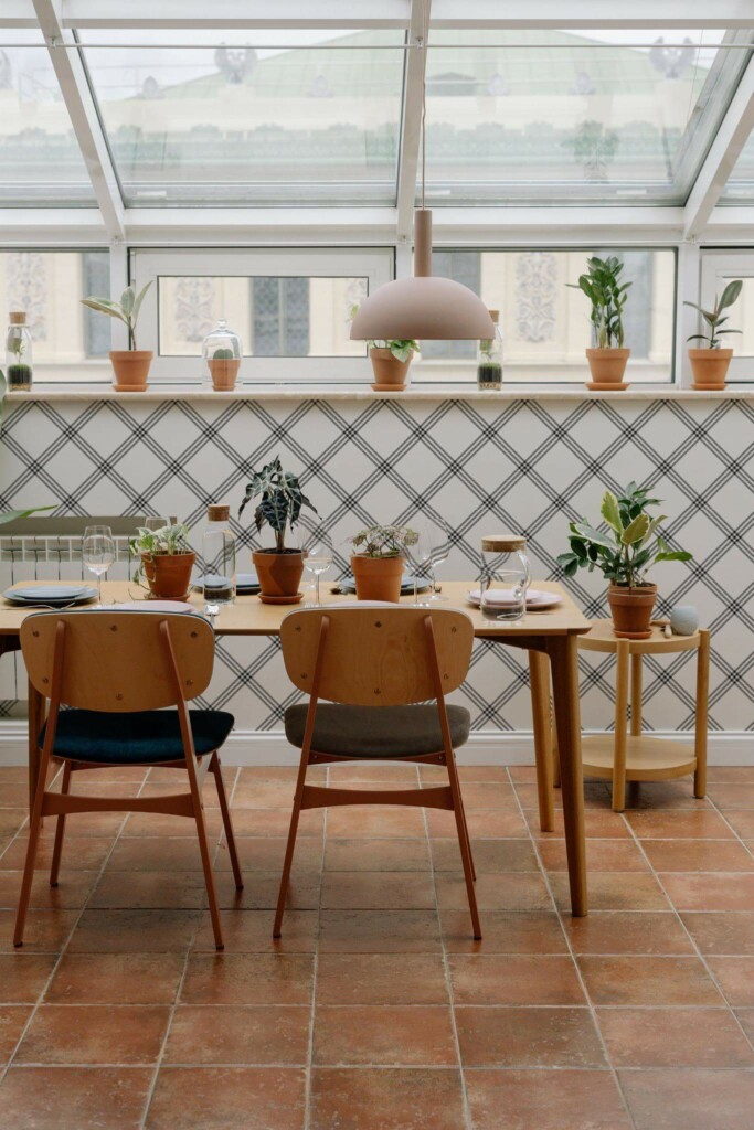 MId-century modern style dining room on a balcony decorated with Black and white plaid peel and stick wallpaper