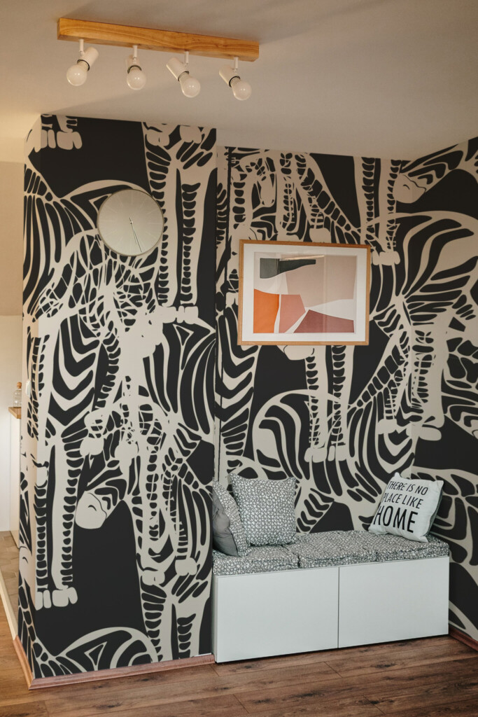 Peel and stick wall murals with black and white zebra silhouettes arranged in an abstract tropical layout, ideal for bold accent walls with animal-inspired charm. The Fancy Walls peel and stick or non-pasted wallpaper.