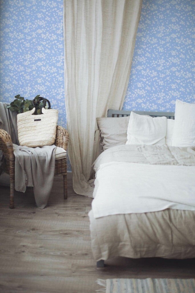 Boho style bedroom decorated with Blue and white daisy peel and stick wallpaper