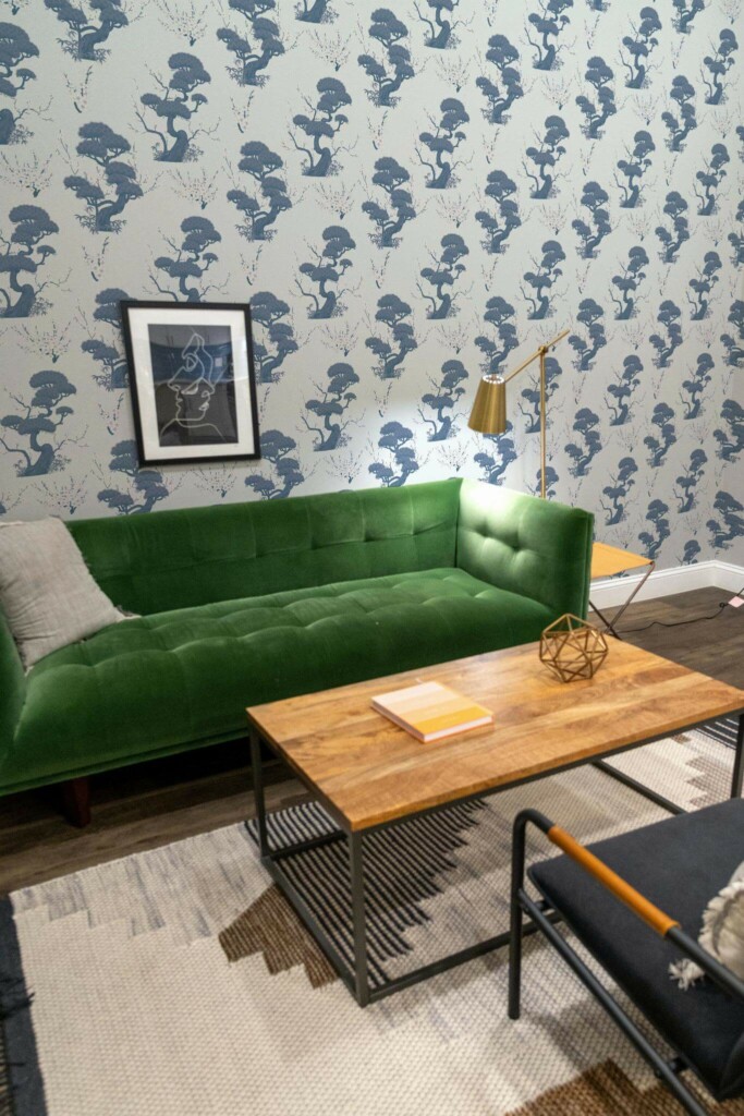 Mid-century modern living room decorated with Blue cherry tree peel and stick wallpaper and forest green sofa