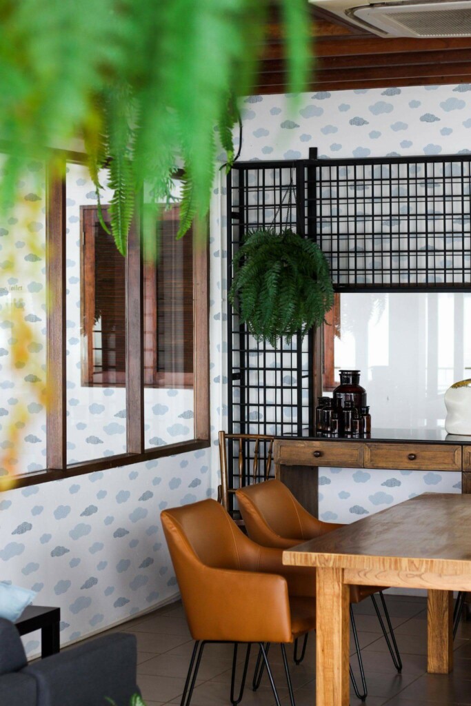 Mid-century modern style dining room decorated with Blue cloud peel and stick wallpaper and black industrial accents