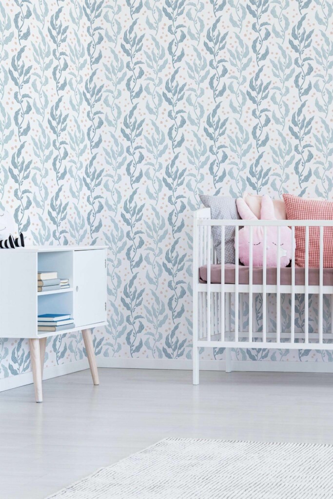 Minimal girly style nursery decorated with Blue leaf nursery peel and stick wallpaper