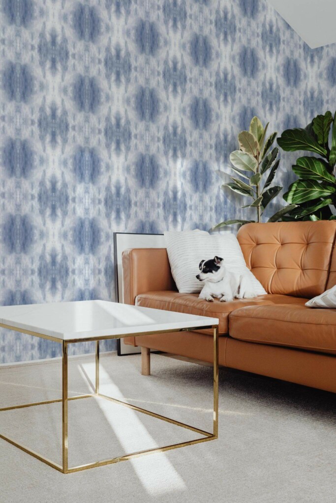 Mid-century modern style living room with dog on a sofa decorated with Blue tie dye peel and stick wallpaper