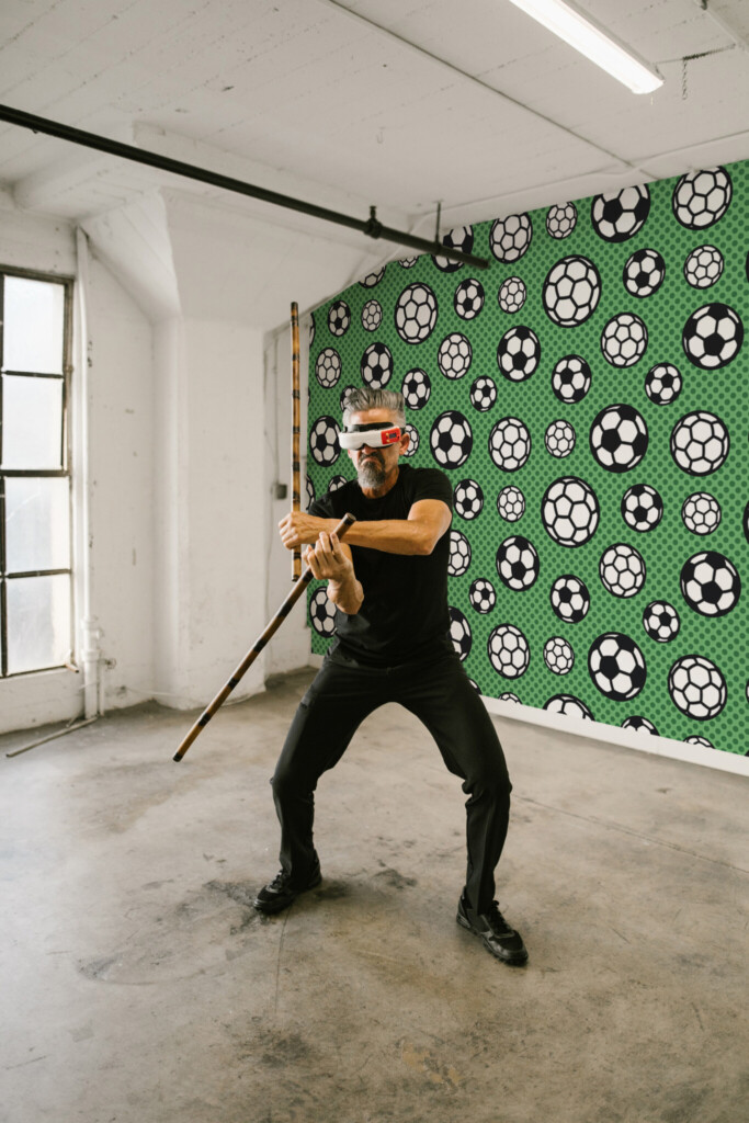 Fancy Walls green football peel and stick wall mural.