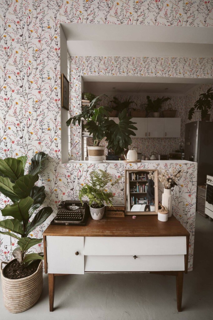 Boho style living room and kitchen decorated with Botanical peel and stick wallpaper and green plants