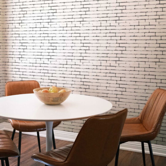 Grunge white and black brick pattern wallpaper in dining room