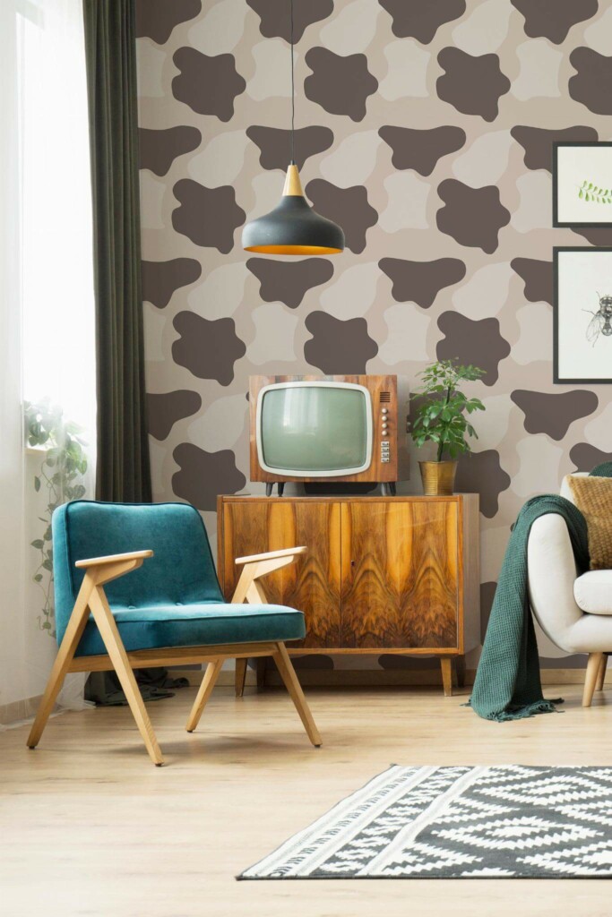 Mid-century modern style living room decorated with Brown Cow print peel and stick wallpaper