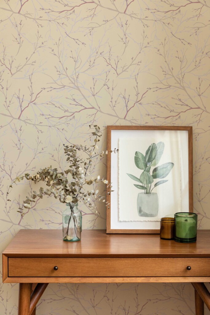 Wooden console table with framed botanical art and vases in front of soft brown plant and tree wallpaper. The wallpaper’s neutral background and earthy branch illustrations add a calming, organic touch, ideal for home spas, entryways, or wellness studios with a modern natural aesthetic.