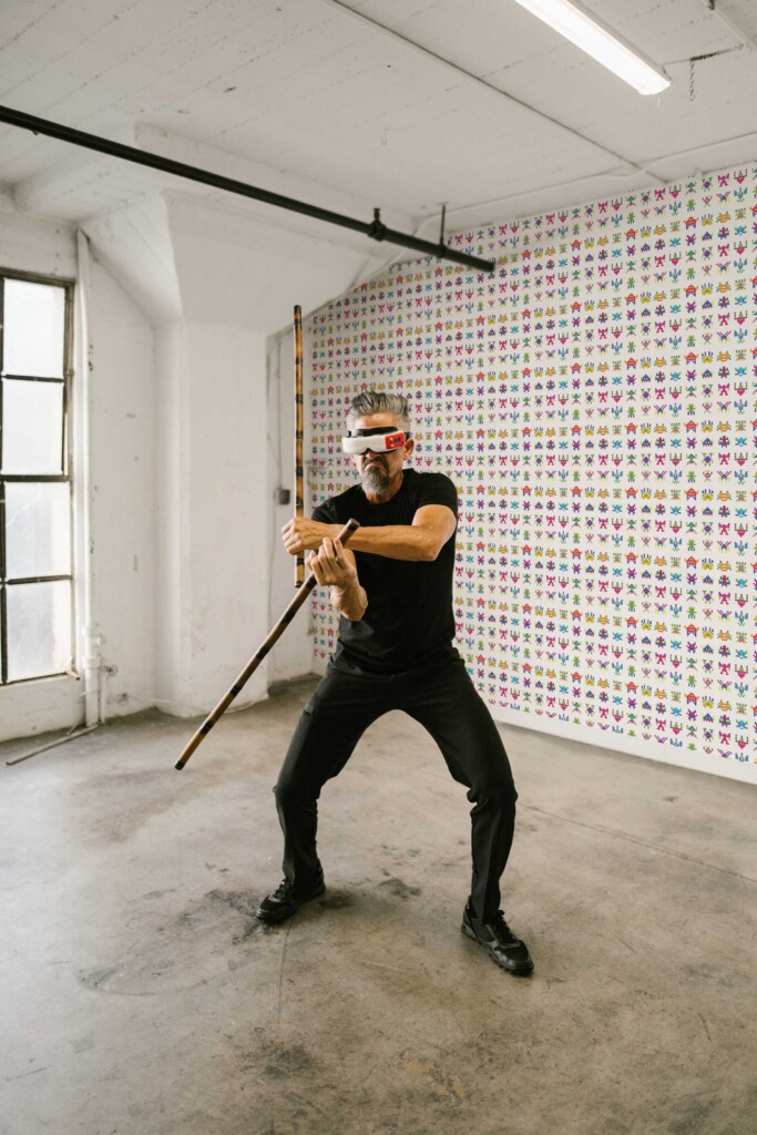 Fancy Walls peel and stick wallpaper with colorful pixel monsters