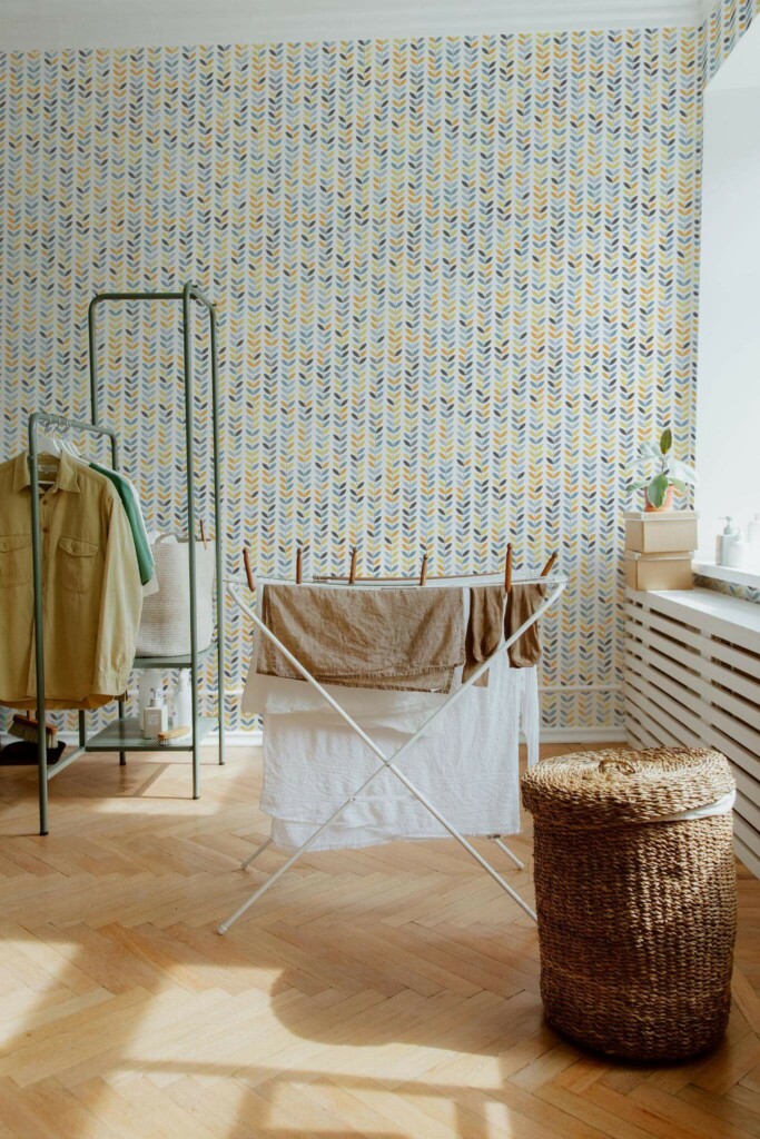 Boho farmhouse style laundry room decorated with Colorful scandi leaf peel and stick wallpaper