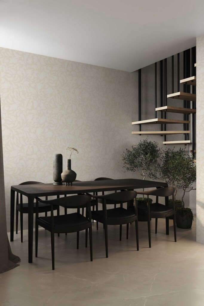 Contemporary dining room with a black wood table, modern pendant lights, and greenery, styled with soft neutral wallpaper showcasing a beige swirling damask pattern. Fancy Walls removable peel and stick or non-pasted wallpaper.