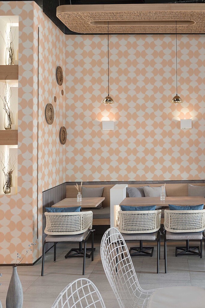 Café seating area styled with Cute Bakery Peach Tiles wallpaper in the background. The repeating curved tile shapes bring vintage energy and modern contrast, perfect for eclectic dining spaces or boutique bakeries.