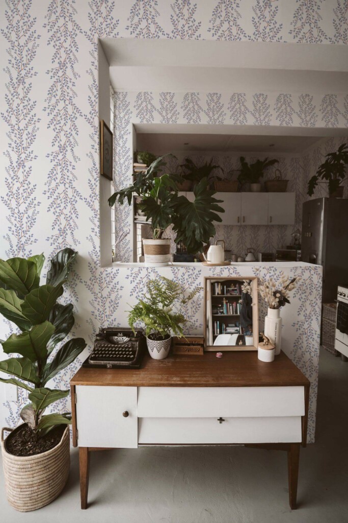 Boho style living room and kitchen decorated with Easter branch peel and stick wallpaper and green plants