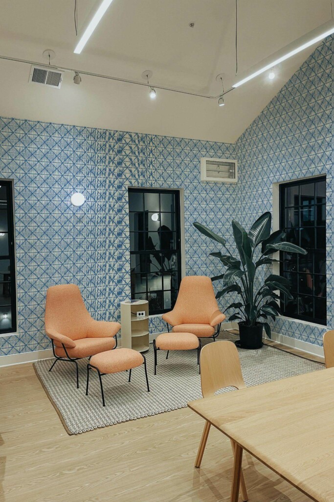 Minimal style living room decorated with Geometric ikat peel and stick wallpaper and mid-century style chairs