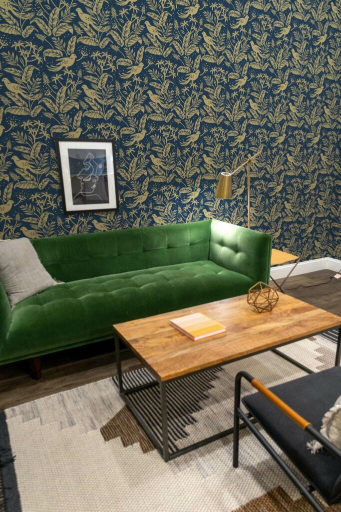 Mid-century modern living room decorated with Golden Bird peel and stick wallpaper and forest green sofa