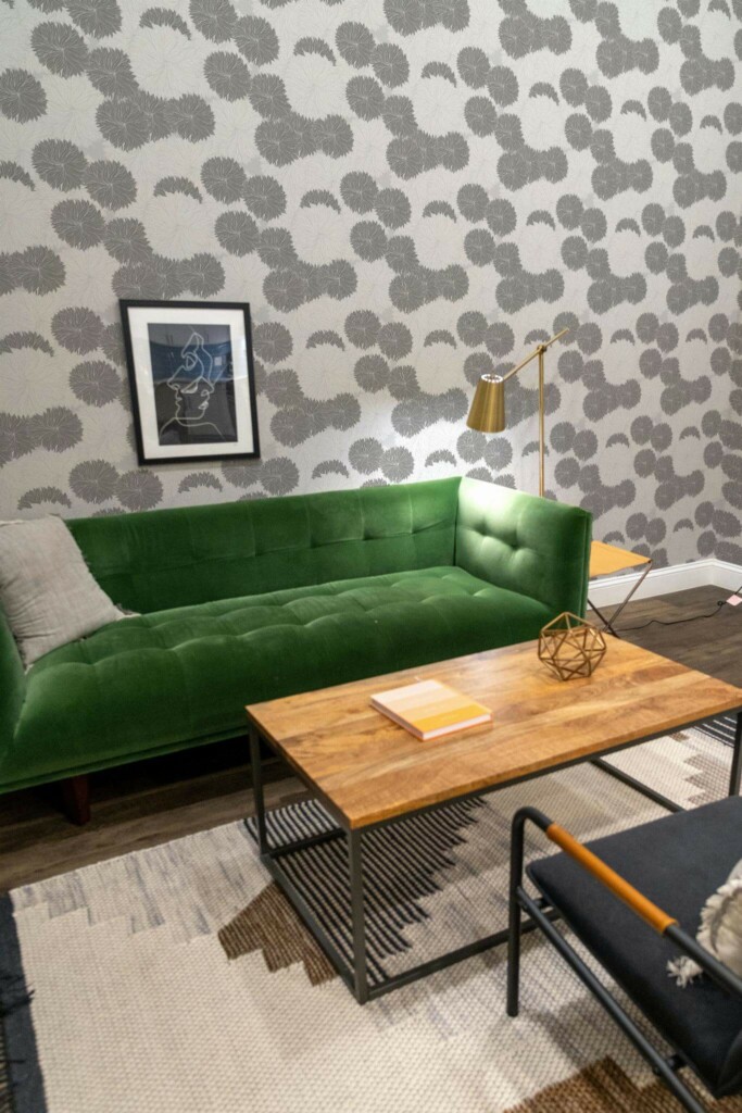 Mid-century modern living room decorated with Gray and white floral peel and stick wallpaper and forest green sofa