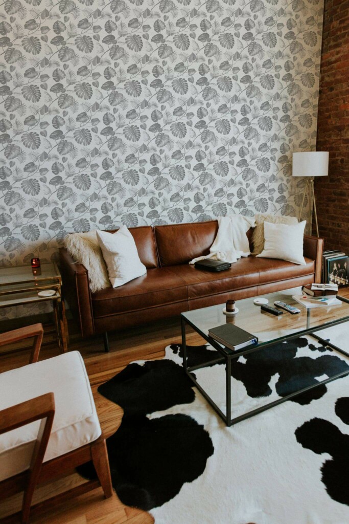 Mid-century modern style living room decorated with Gray and white tropical leaf peel and stick wallpaper