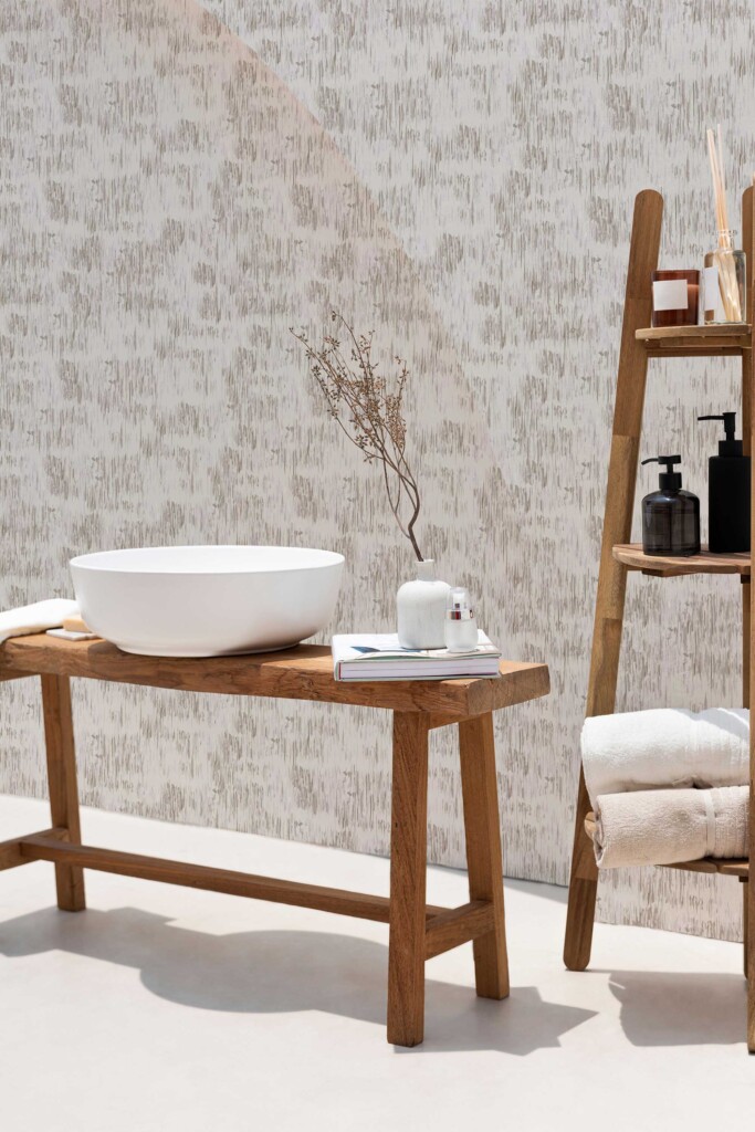 A serene spa bathroom featuring Fancy Walls peel and stick or non-pasted wallpaper with gray brush stroke pattern, complemented by natural wood furniture, soft towels, and a calming neutral palette.