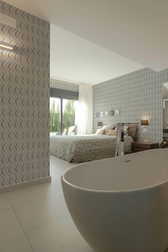 Modern style bedroom with open bathroom decorated with Gray herringbone peel and stick wallpaper