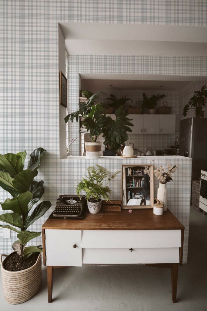 Boho style living room and kitchen decorated with Gray plaid peel and stick wallpaper and green plants