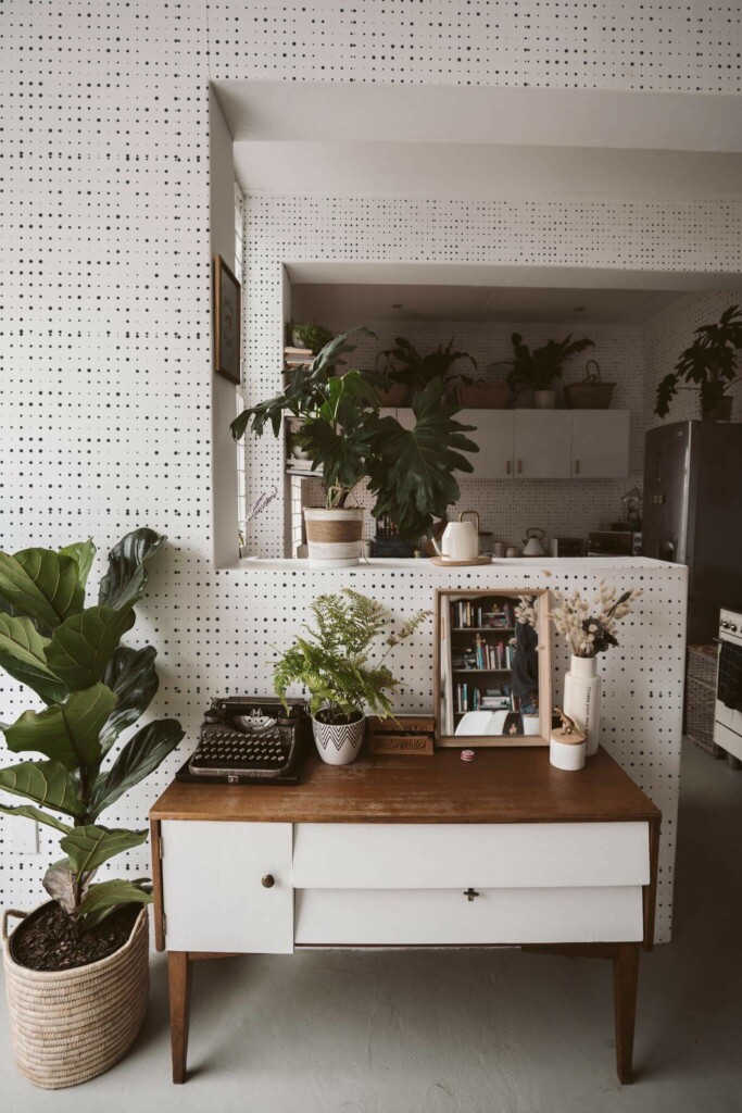 Boho style living room and kitchen decorated with Halftone peel and stick wallpaper and green plants