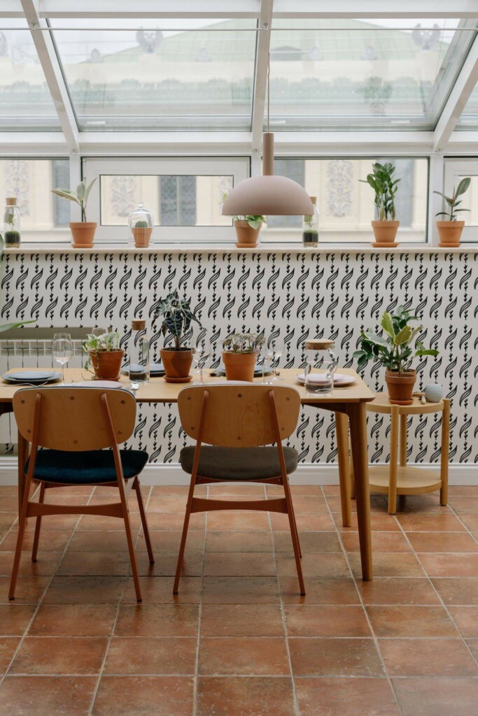 MId-century modern style dining room on a balcony decorated with Leaf motive peel and stick wallpaper