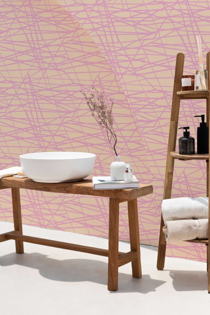 Bathroom setting featuring Pink Bakery Linear Vibes wallpaper by Fancy Walls peel and stick or non-pasted wallpaper. The soft geometric lines in pink add subtle dynamism to neutral interiors, working beautifully with wooden elements and minimalist décor.