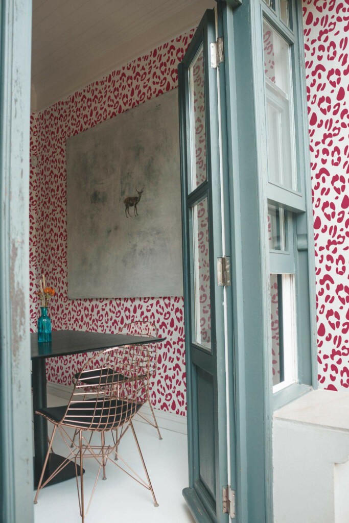 Minimal coastal style cafe decorated with Magenta leopard print peel and stick wallpaper