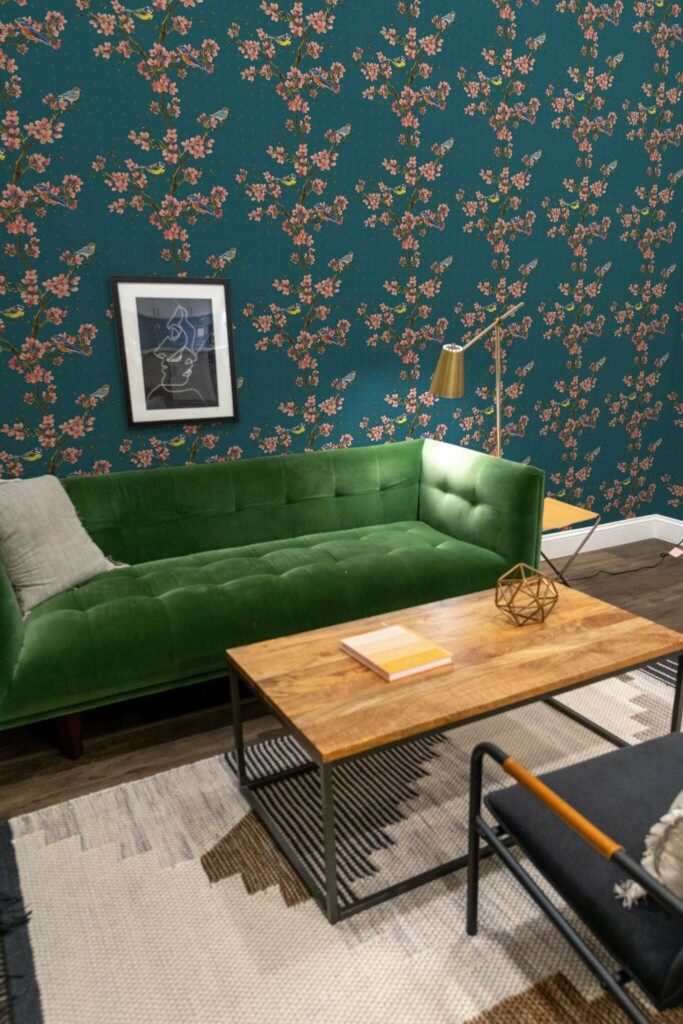 Mid-century modern living room decorated with Midnight bird peel and stick wallpaper and forest green sofa