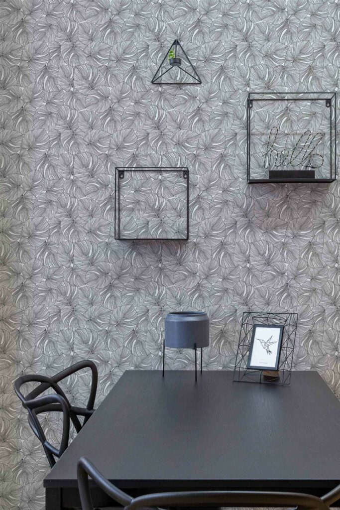 Industrial modern style dining room decorated with Monstera leaf peel and stick wallpaper