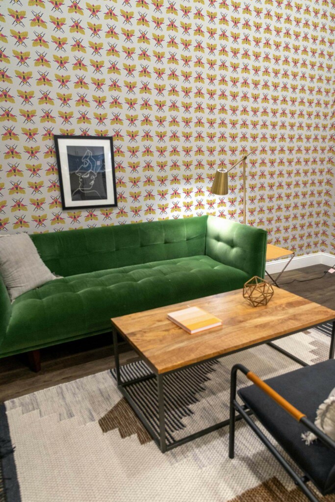 Mid-century modern living room decorated with Multicolor bug peel and stick wallpaper and forest green sofa
