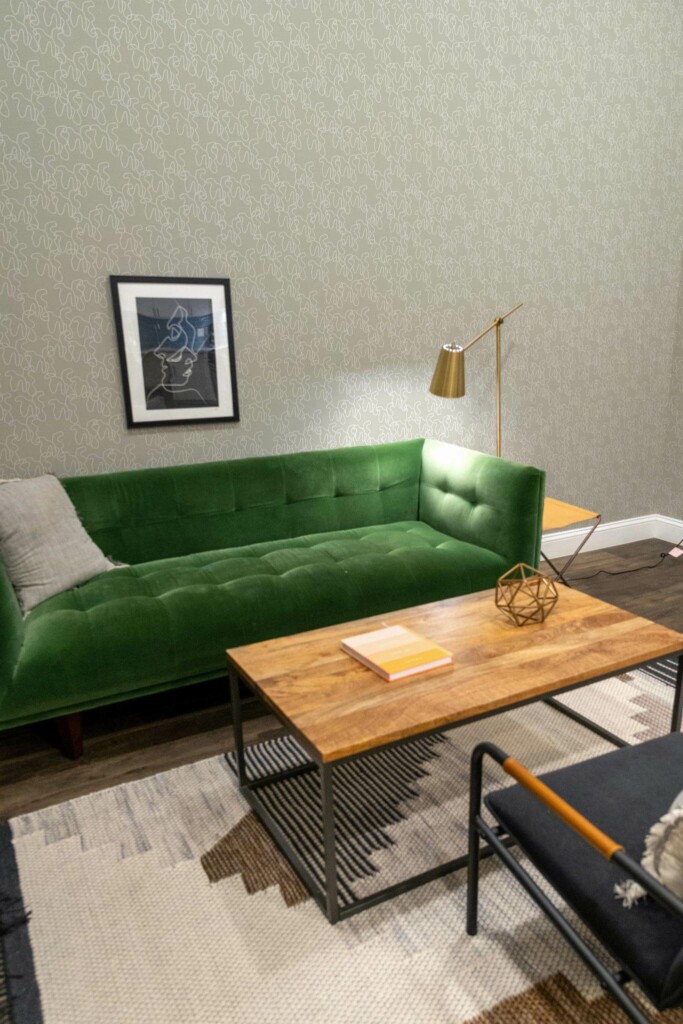 Mid-century modern living room decorated with Neutral shapes peel and stick wallpaper and forest green sofa