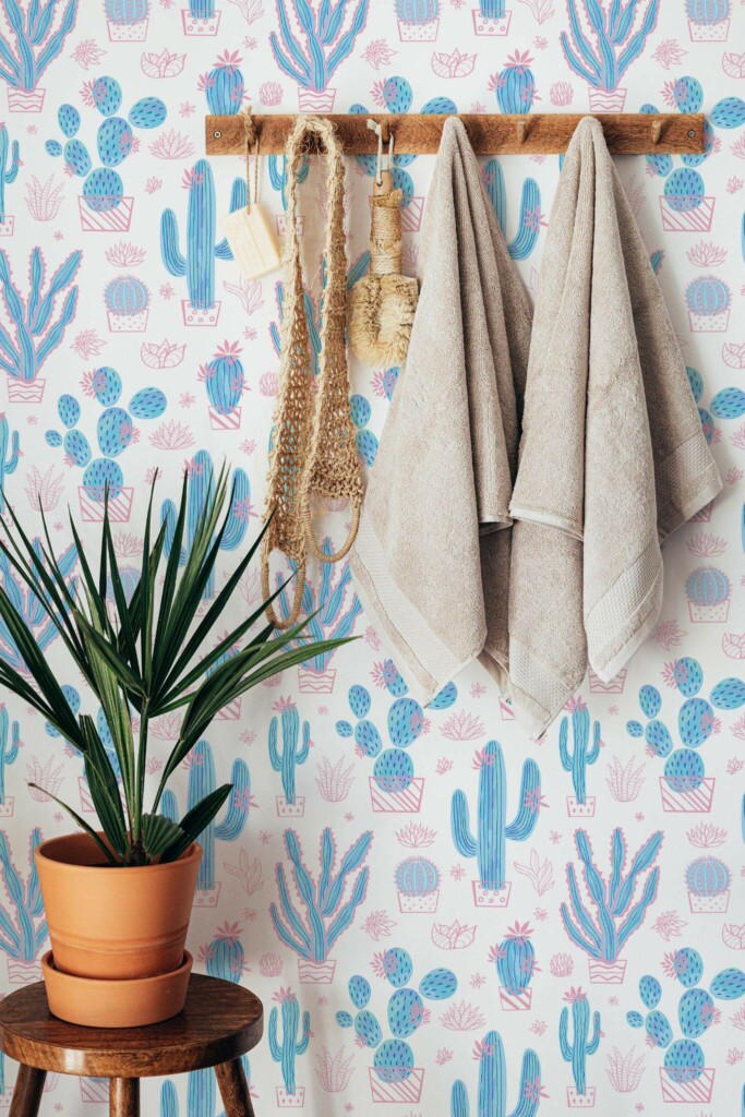 Boho style bathroom decorated with Pink and blue cactus peel and stick wallpaper