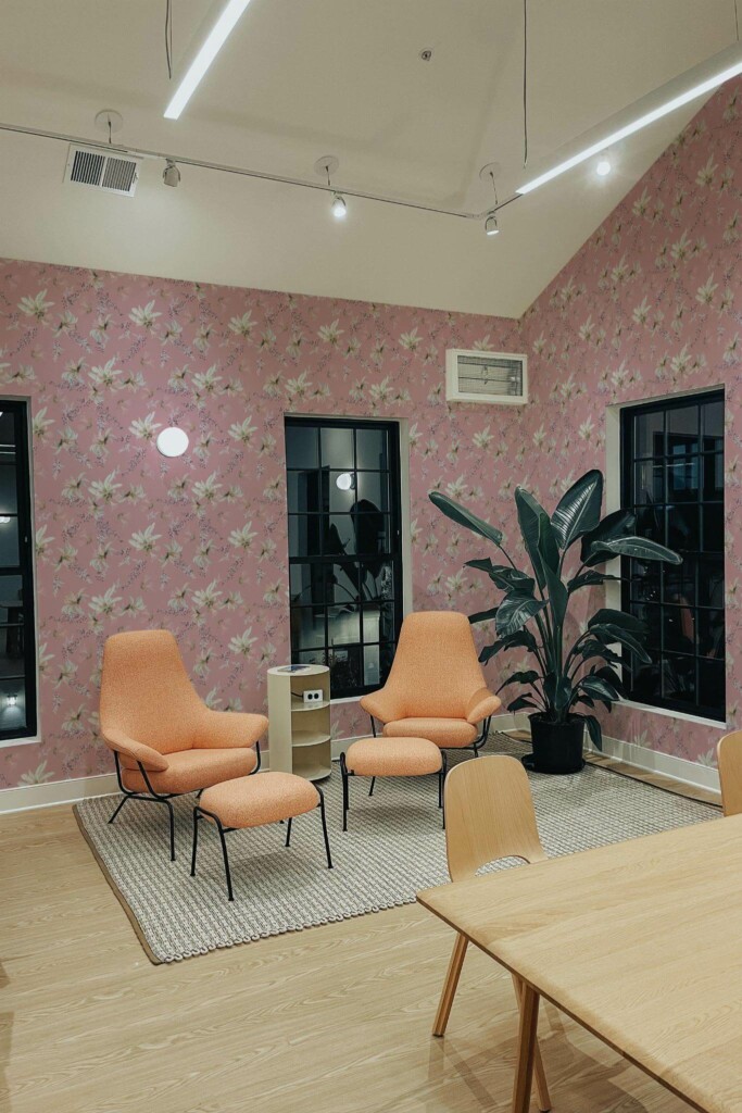 Minimal style living room decorated with Pink and white tropical floral peel and stick wallpaper and mid-century style chairs